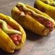 Knish hot dogs on wooden cutting board